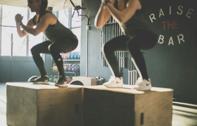 People exercising during a fitness training session in a gym