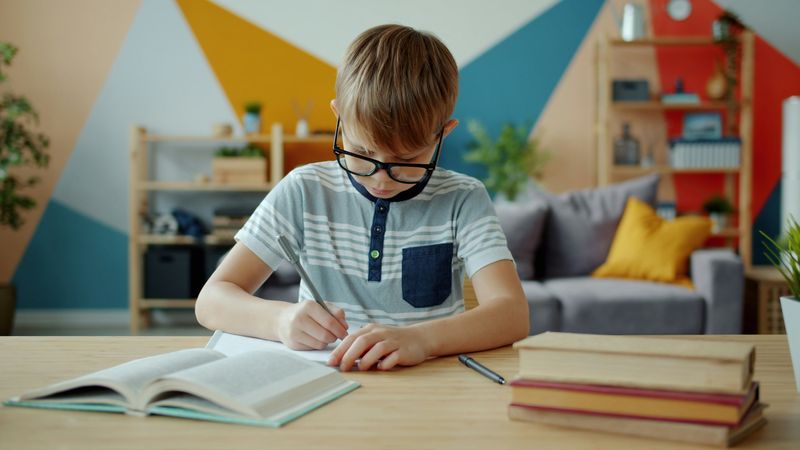 Student studying at a desk in a classroom